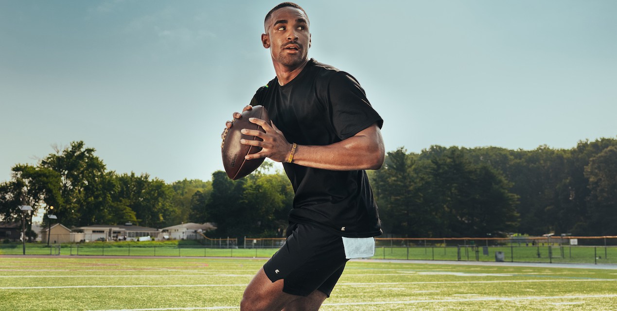 Philadelphia Eagles quarterback Jalen Hurts gets ready to throw a football on the field