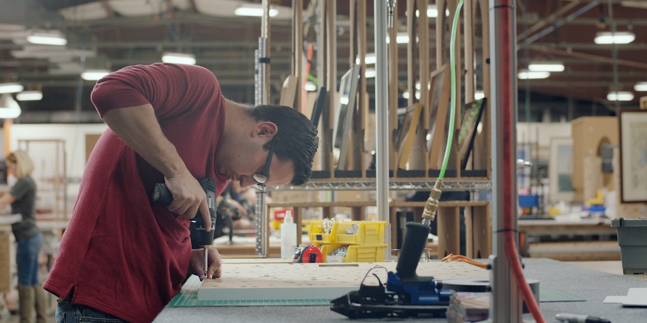 Employee at picture frame company Framebridge's factory