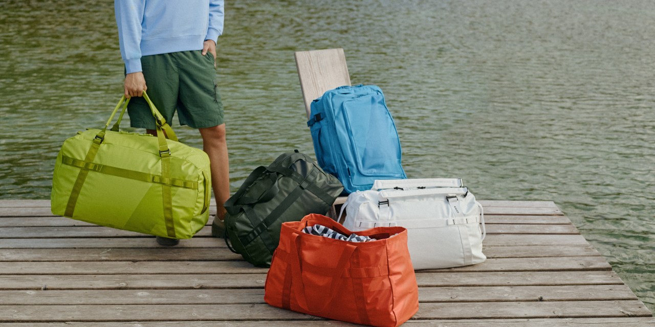 Yellow, red, blue, white and green duffel bags and backpacks from Away