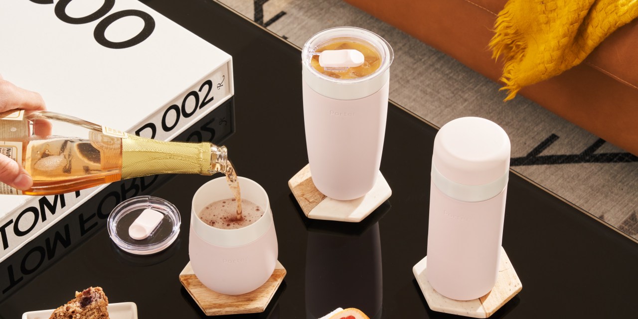 a trio of reusable tumblers on a table