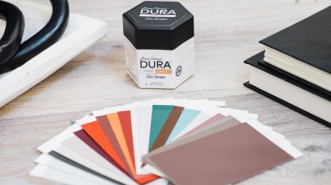 A fan of colorful paint chips from Dura