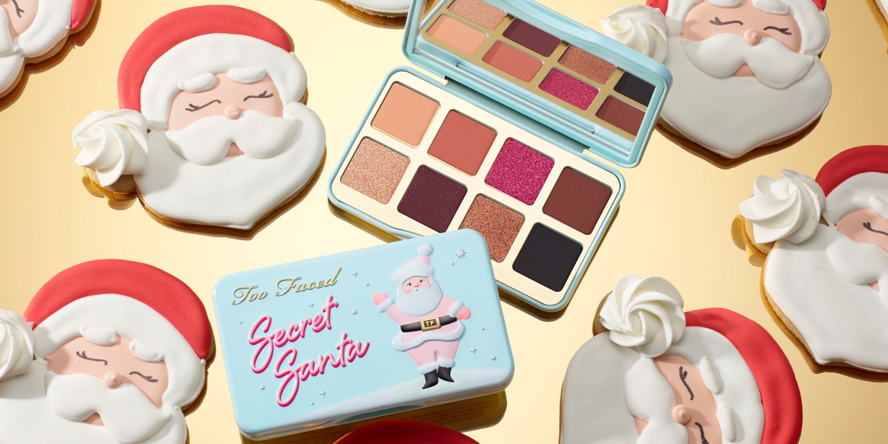 A Too Faced makeup palette is wide open.