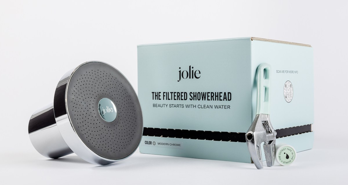 Jolie filtered showerhead on a white background next to a mint green box.