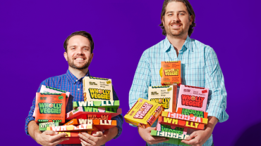 Wholly Veggie executives holding their products.