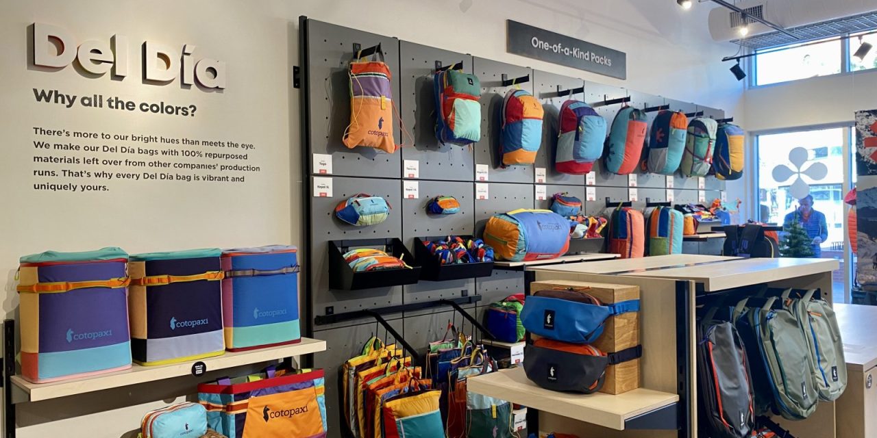 A wall of backpacks from Cotopaxi at its Denver store.