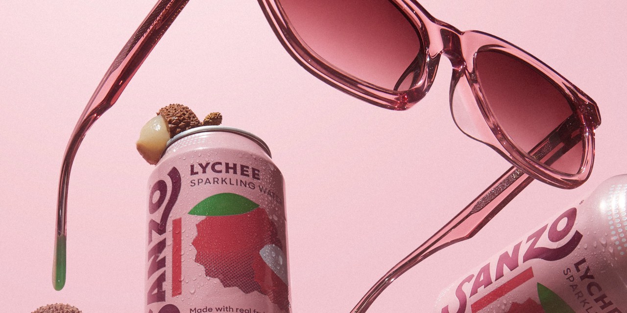 Sanzo's lychee flavor alongside pink sunglasses.