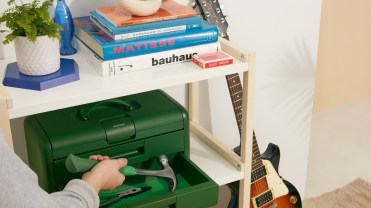 Character's toolbox on a white shelf.