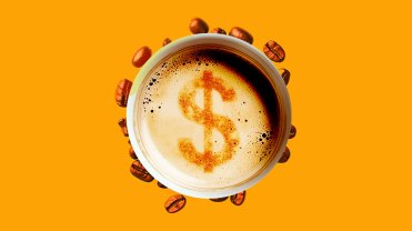 Cup of latte surrounded by a ring of coffee beans. with a dollar sign in the middle.