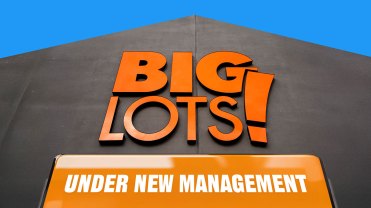 Big Lots storefront with a sign that reads "under new management"
